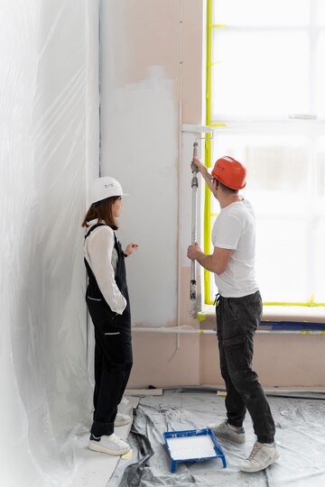 our craftsman skillfully working on the walls